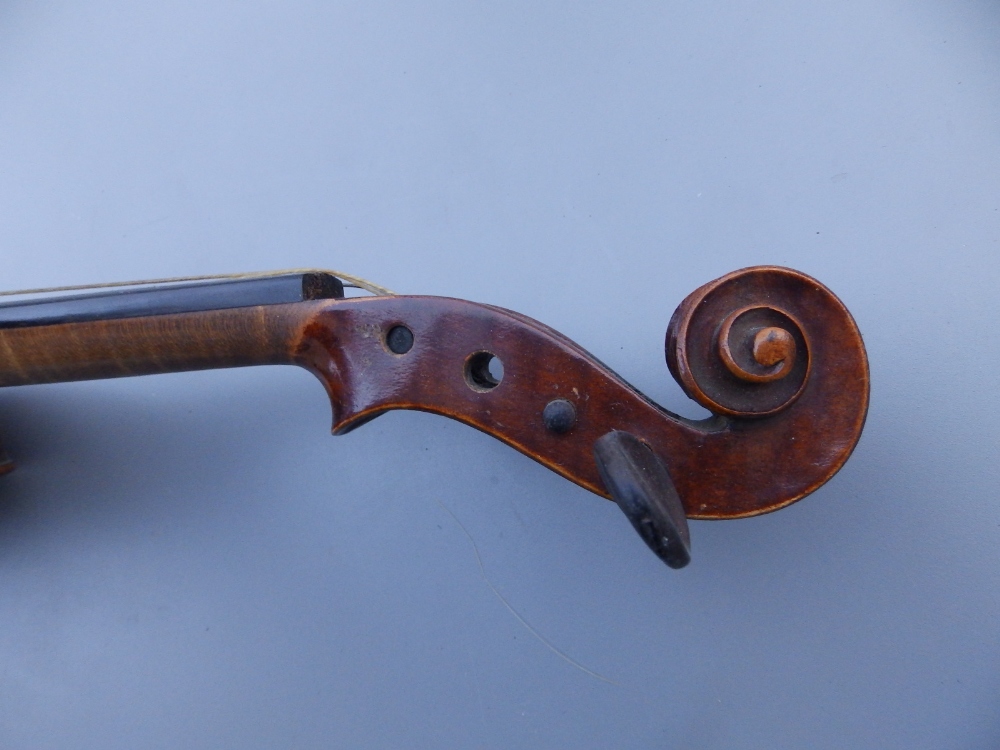 A Stradivarius copy violin by E R Schmidt & Co with 14.25" two piece back, together with two bows in - Image 8 of 12
