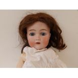 A Halbig, Kammer & Reinhardt bisque head doll with sleeping blue paperweight eyes, open mouth,