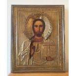 A Russian painted icon in gilt metal frame, a letter of provenance to verso from Warwick Crampton of