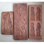 Three wooden biscuit moulds, one depicting a bishop, the largest , 21".