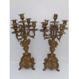 A pair of 19thC gilt brass four branch five light candelabra, 18" - one sconce missing.