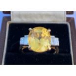 An art deco style certified natural 8.3 carat yellow Sri-Lankan sapphire & diamond ring, the four-