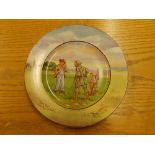 An early 20thC golfing plate decorated in colours -'Carry Your Caddy Sir?', 10" diameter.