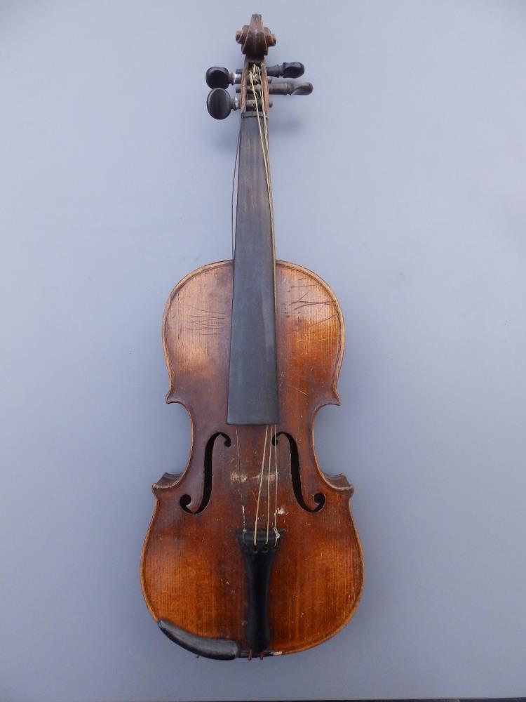 An antique violin with 13" two piece back and bow in wooden case.