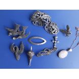 Two marcasite brooches, a silver bracelet and six other pieces of costume jewellery. (9)