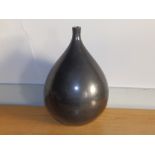 A French black glazed art pottery onion shaped vase with narrow neck, incised to underside 'Made