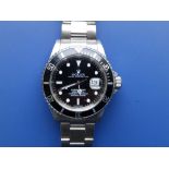 A boxed Rolex Submariner Oyster Perpetual Date Submariner, the black dial with luminous hour