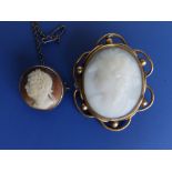 A small 19thC circular hardstone cameo set silver brooch, depicting the head of a senator in