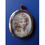 A 19thC gold mounted oval watercolour miniature, depicting a young girl with blue ribbon in her