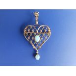 An opal, peridot & pearl set '9ct' openwork heart shaped pendant/brooch, 2.25" overall height.