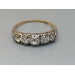A five stone graduated old cut diamond ring on 18ct gold shank. Finger size P.