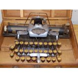 A Blickensderfer aluminium portable 'Featherweight' typewriter in replacement oak case - 501