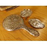 An embossed silver cherub's head pattern hand mirror - Chester 1905, a small quatrefoil tray, 5" -