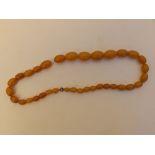 A faux amber graduated bead necklace , the largest bead 22mm, 45g, 19".