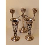A modern Birmingham silver candelabrum, 9" high and a pair of London silver spill vases with blue