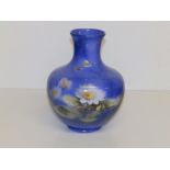 A Royal Doulton Titanian Ware vase by S. Hall, painted waterlilies & butterflies on blue ground - '