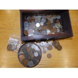 A box containing a quantity of coins.