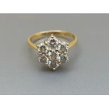 A modern diamond daisy cluster ring on 18ct gold shank with Sheffield marks. Finger size G/H.