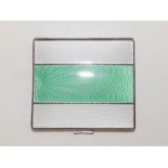 A guilloche enamelled silver cigarette case, the hinged cover with three bands of white & green -