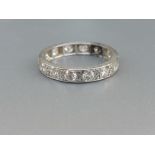 A diamond set white metal eternity ring. Finger size I/J - a/f.