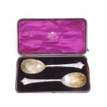 A cased pair of silver serving spoons with fluted shell bowls - Sheffield 1889/90, 9", in Goldsmiths