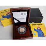 A boxed Royal Mint 'Paddington At The Station' 2018 50p Gold Proof Coin, with paperwork - No.334.