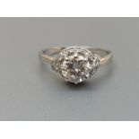 A diamond solitaire ring, the claw set brilliant weighing approximately 0.90 carat, raised above a