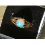 An opal set 9ct gold ring, a 9ct signet ring and one other. (3)