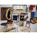 A leather case & contents of costume jewellery