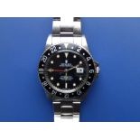 A boxed 1984 Rolex Oyster Perpetual GMT Master, the black dial with date indicator, luminous hour
