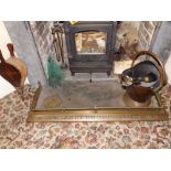 A copper coal scuttle, a fender, bellows and fire irons. Separate viewing arrangements by