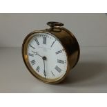 A brass drum cased GWR clock, the white enamel dial marked for J.M. Skarratt & Cie., Paris, numbered