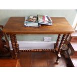 A Victorian walnut stretcher table, 35" wide and a white japanned standard lamp. (2) Separate
