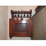 A smoker's wall cabinet, a humidor and other related items. Separate viewing arrangements by