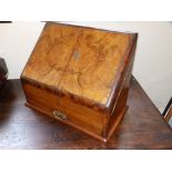 A Victorian walnut sloping front stationery box, 15" across.