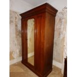 A Victorian wardrobe, a duchesse dressing table and a pair of walnut bedside cabinets. (4)