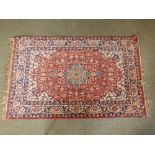 A finely knotted Oriental arabesque medallion pattrn rug, 65" x 41" - a/f.