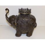 An Oriental bronze elephant incense burner, 9.5" high.