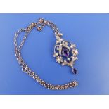 An amethyst & pearl set 9ct gold openwork pendant on a 375 belcher link necklace.