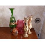 A 7.5" high engraved cranberry glass vase, a 13" high gilded green glass vase, a pair of gilded