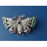 A rose cut diamond & coloured gemstone set butterfly brooch, having three pearls to the body, 1.6"