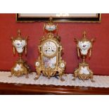 A 19thC porcelain mounted gilt spelter three piece French clock garniture by Marti, having bell