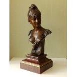 An art nouveau bronze bust of a young girl by Anton R. Nelson (1880-1910) - 'Moutime', signed &