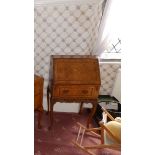 A reproduction walnut lady's bureau and two bedside cabinets. (3) Separate viewing arrangements by