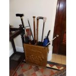 A copper faced umbrella stand with umbrellas, various sticks and a cast iron oak leaf tray, 18.5"