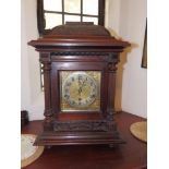 A 19thC German mahogany stained chiming mantel clock, the square brass dial with silvered chapter