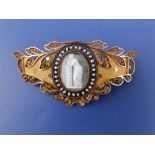 A 19thC Classical Revival style 18ct gold panel brooch, set with a central oval cameo depicting a