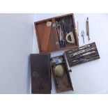 A pair of Victorian travelling scales in mahogany case and a case of technical drawing instruments.