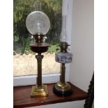 A Victorian brass corinthian column oil lamp with cut glass reservoir, 30" overall and one other. (