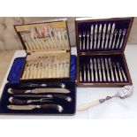 A cased silver mounted horn-handled carving set retailed by Harrods - Sheffield 1919, a pair of